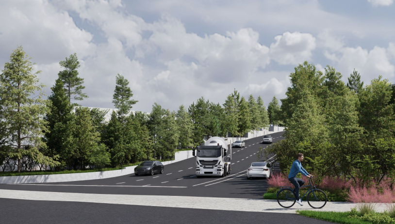 A cyclist rides alongside a road with cars and a truck. Tall trees line the road under a partly cloudy sky, creating a peaceful, natural atmosphere.
