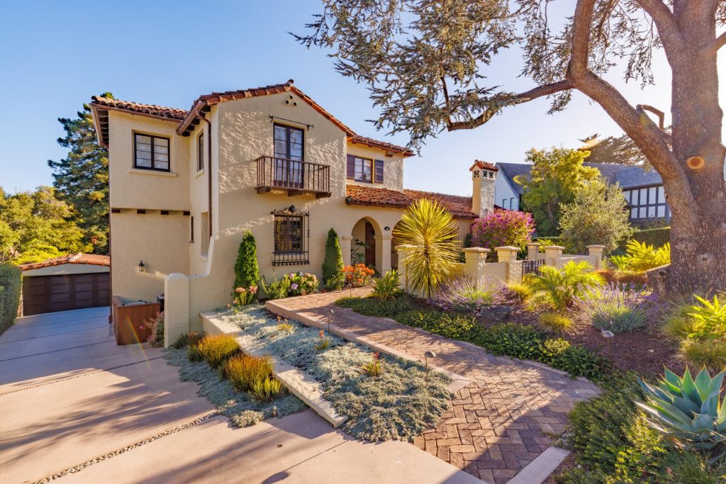 Spanish Revival home in Piedmont with drought-tolerant front garden and paver driveway